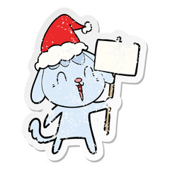 cute distressed sticker cartoon of a dog wearing santa hat