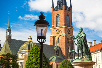 Statue of King Gustav Vasa in front of Riddarholmen Church in Stockholm, Sweden. Summer sunny day.