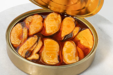 studio image of a can of mussels