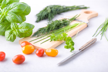 Vegetables and spices on a chopping board.