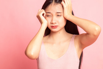 Young Asian woman got sick and  headache.