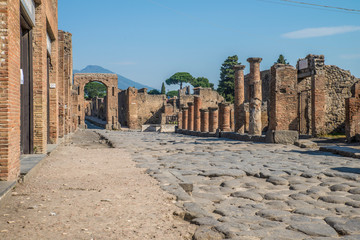 POMPEII, ITALY - 8 August 2015: Ruins of antique roman temple in Pompeii near volcano Vesuvius, Naples, Italy