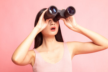 Young Asian woman with binoculars.
