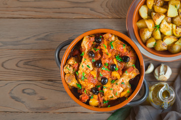 Pollo alla cacciatora- italian hunter-style chicken with onions,  tomatoes,  bell peppers, olives and wine.