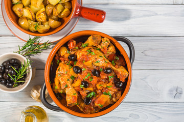 Pollo alla cacciatora- italian hunter-style chicken with onions,  tomatoes,  bell peppers, olives and wine.