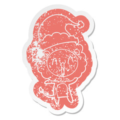 happy cartoon distressed sticker of a lion wearing santa hat