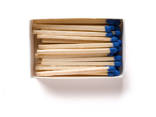 matchbox with blue matchsticks on white with clipping path