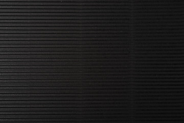 cardboard corrugated pattern background horizontal at black color