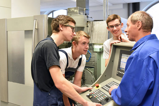 Group of young people in technical vocational training with teacher