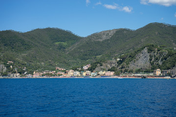 Obraz premium Italy, Cinque Terre, Monterosso, a large body of water with a mountain in the background