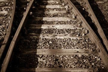 Sepia photo of some old rails retro backgroun