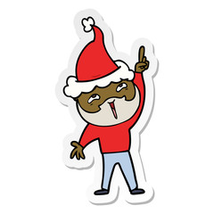 sticker cartoon of a happy bearded man wearing santa hat