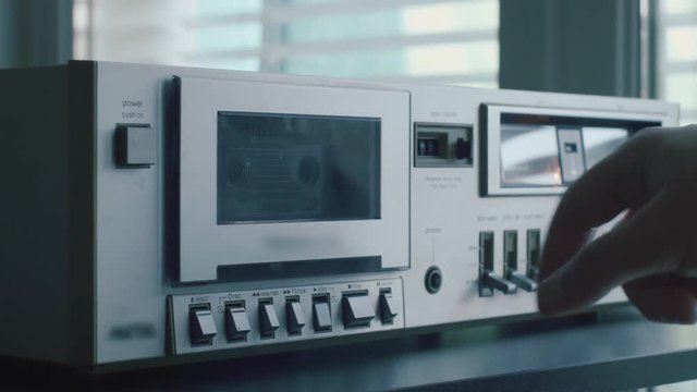 Turning on a Vintage Analog Music Cassette Deck Tape Player