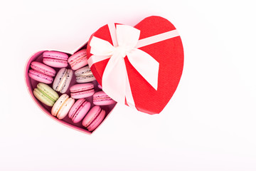 Macaroons cookies on a heart box isolation on a white background
