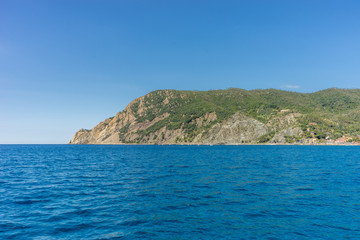 Fototapeta na wymiar Italy, Cinque Terre, Monterosso, Monterosso al Mare, SCENIC VIEW OF SEA AGAINST CLEAR BLUE SKY