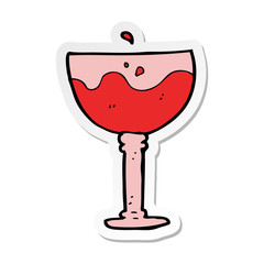 sticker of a cartoon glass of wine