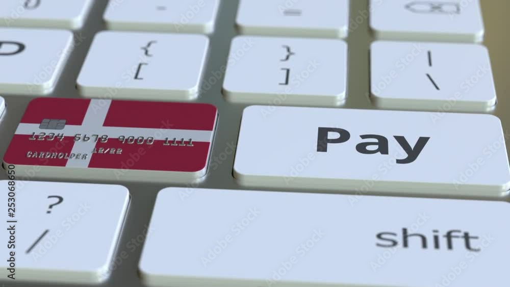 Poster bank card featuring flag of denmark as a key on a computer keyboard. danish online payment conceptua