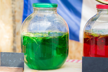 Bank with green lemonade. Tarragon