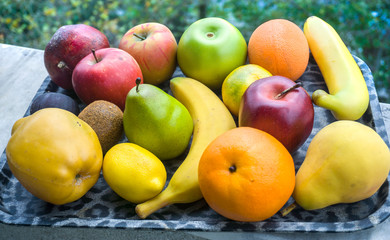 Assortment of different various organic fruits. Fresh food concept, colorful bright background. Composition of assorted fresh ripe raw organic fruits. Healthy lifestyle, dieting concept, clean eating.