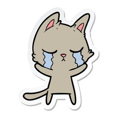 sticker of a crying cartoon cat