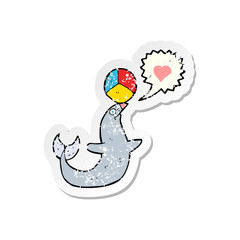 retro distressed sticker of a cartoon seal with ball