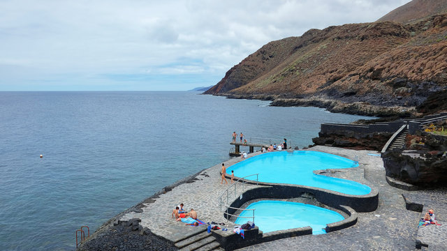 Natural sea water pools in La Caleta, a very popular resort among locals and tourists, close to the capital of the island Valverde, with views towards Atlantic, El Hierro, Canary Islands