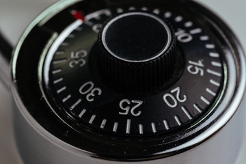 Close up of combination lock with circle of numbers and code to unlock using as security, safety and hacking concept