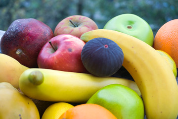 Assortment of different various organic fruits. Fresh food concept, colorful bright background. Composition of assorted fresh ripe raw organic fruits. Healthy lifestyle, dieting concept, clean eating.