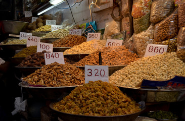 Top view of dry fruit samples nicely stacked placed in bowls and put on display in a shop in old Delhi spice market Khari Bouli, Chandni Chowk, Old Delhi, India