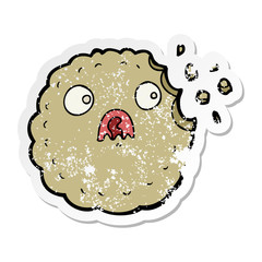distressed sticker of a frightened cookie cartoon