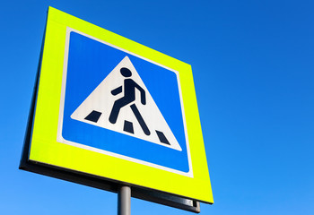 Road sign Pedestrian crossing against the blue sky