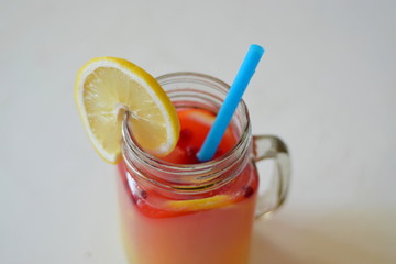 glass of orange juice on white background