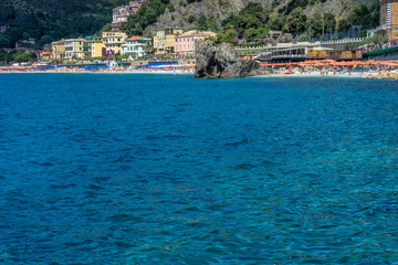 Fototapeta na wymiar Italy, Cinque Terre, Monterosso, a large body of water with a city in the background