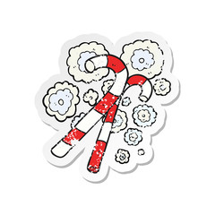 retro distressed sticker of a cartoon candy canes