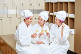 Women celebrating with champagne in wellness  centre