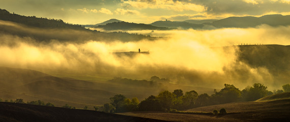 Wonderful, fabulous and misty sunrise in Tuscany