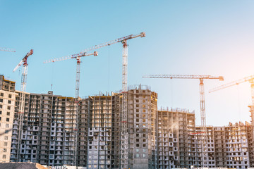 Construction of a residential building and cranes, real estate
