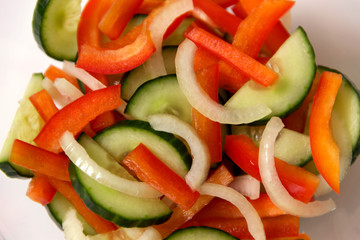 Vegetable salad of Bulgarian pepper, cucumber and onion.