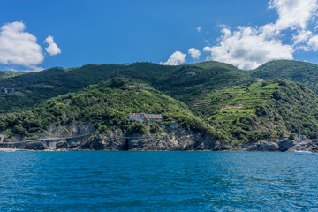 Obraz premium Italy, Cinque Terre, Monterosso, a large body of water with a mountain in the background