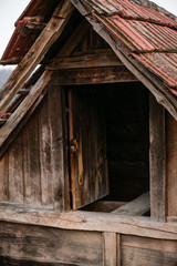 Fototapeta na wymiar Opened doors of a wooden house.