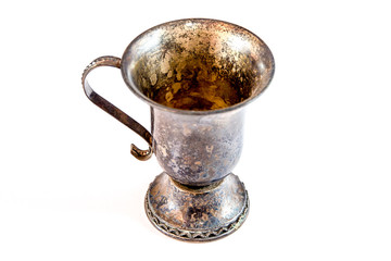 old silver / brass shot glass on white background