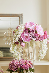 white and purple roses, peonies in glass vase
