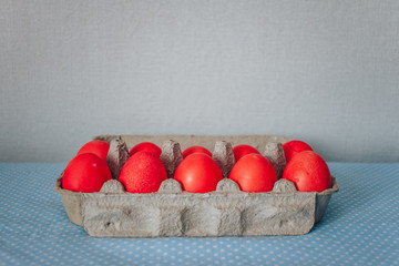 bright easter eggs in a stand with white flowers
