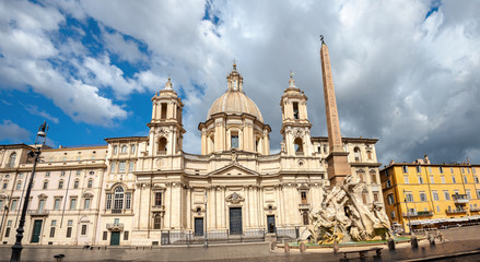 Fototapeta na wymiar Sant Agnese church and fountain on Piazza Navona in Rome, Italy