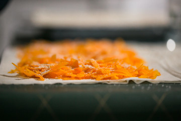 Preparation of pumpkin and apple pie with phyllo crust.