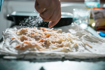 Preparation of pumpkin and apple pie with phyllo crust.