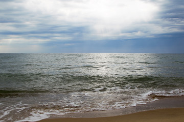 Seascape with clouds in the sky with waves