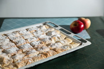 Preparation of pumpkin and apple pie with phyllo crust.
