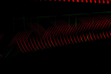 Abstract lines of bright colors formed by numerous points together forming an abstract art on black background. Futuristic technology concept.
