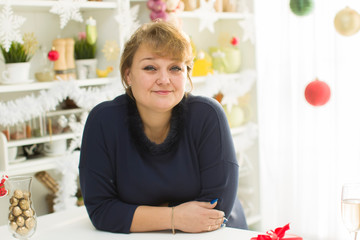 Fat middle aged woman in the kitchen